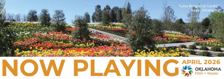 Now Playing April 2026 newsletter header with photo of tulips at Tulsa Botanical Garden